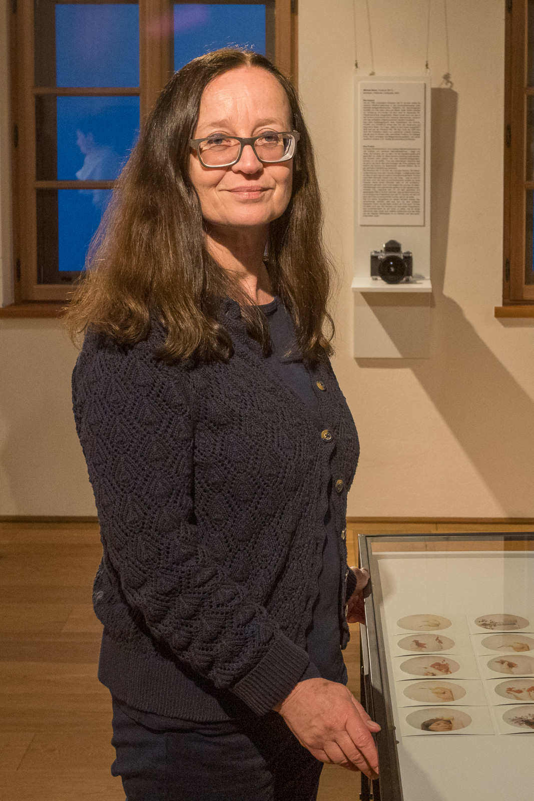 Jutta Fischel with her photos at an exhibition